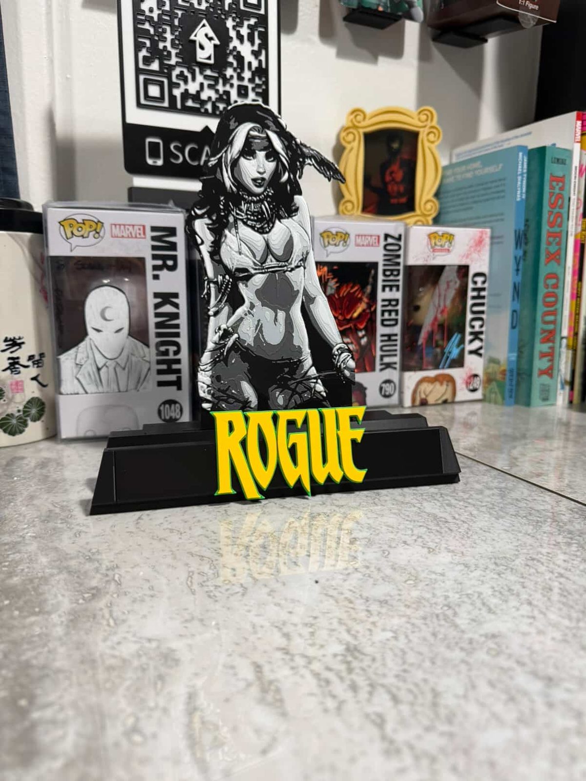 #55 Rogue Comic Book Kickstand — vue 3